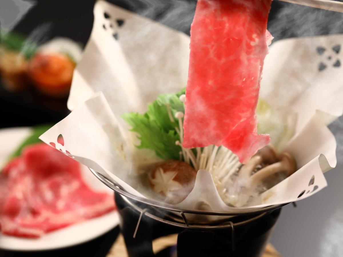 志贺市井酒店 山之內 外观 照片